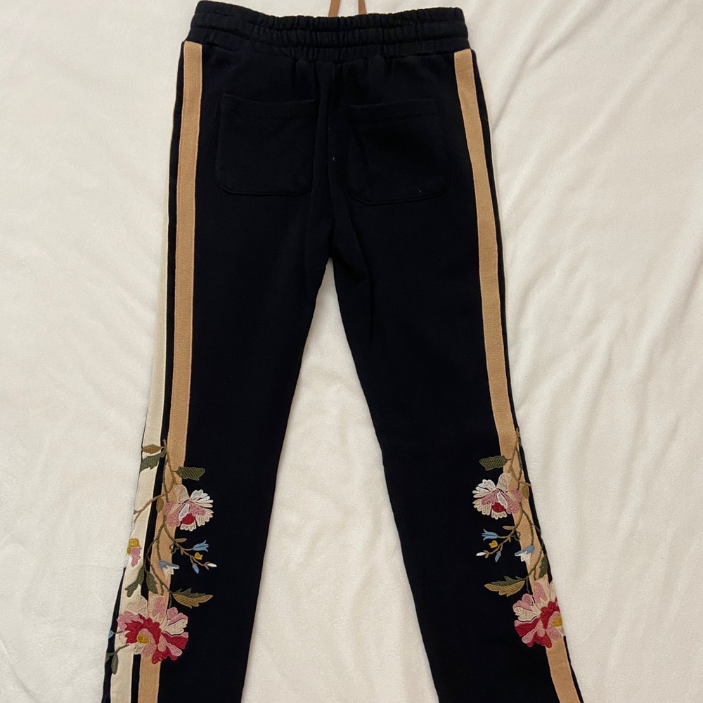 Below the belt embroidered sweat pants